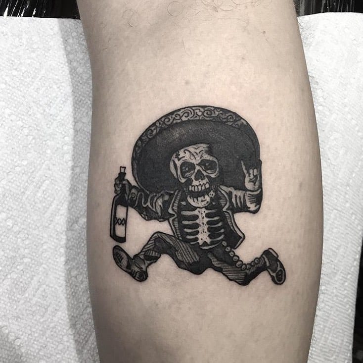 Tattoo of a drunken mariachi skeleton 