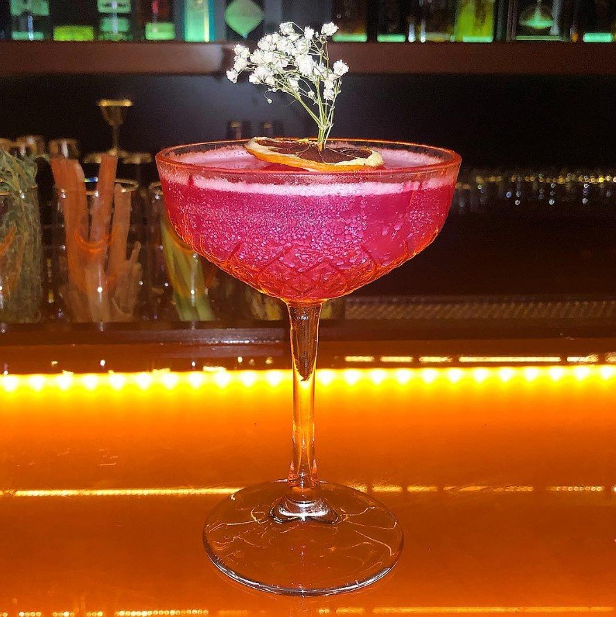 This cocktail uses saril-infused liquor (Jamaican flower)

