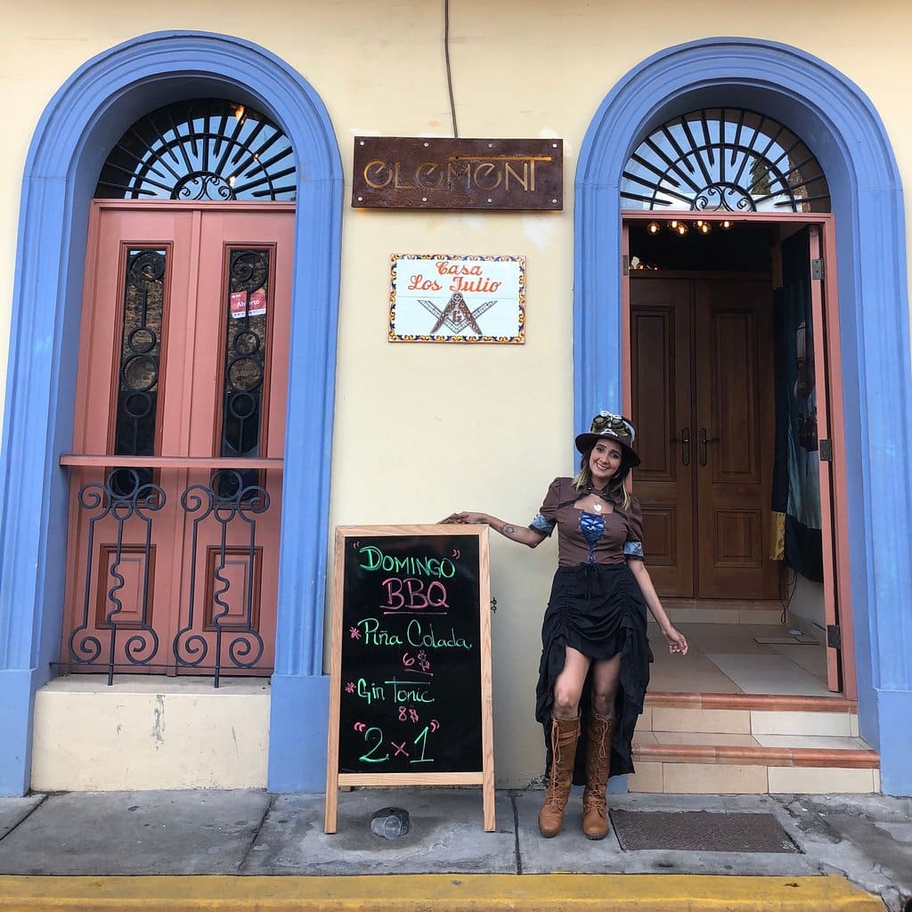 Residents stand outside Element bar inviting walkers through Casco Viejo