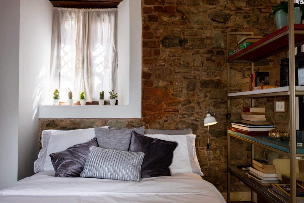 Stunning Small Loft at Casa Neuman bedroom area with chair and book shelve