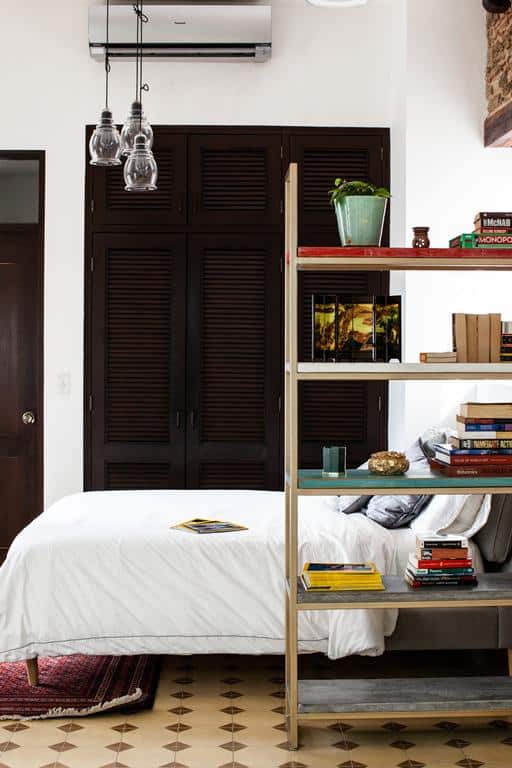 Stunning Small Loft at Casa Neuman bedroom area with chair and book shelve