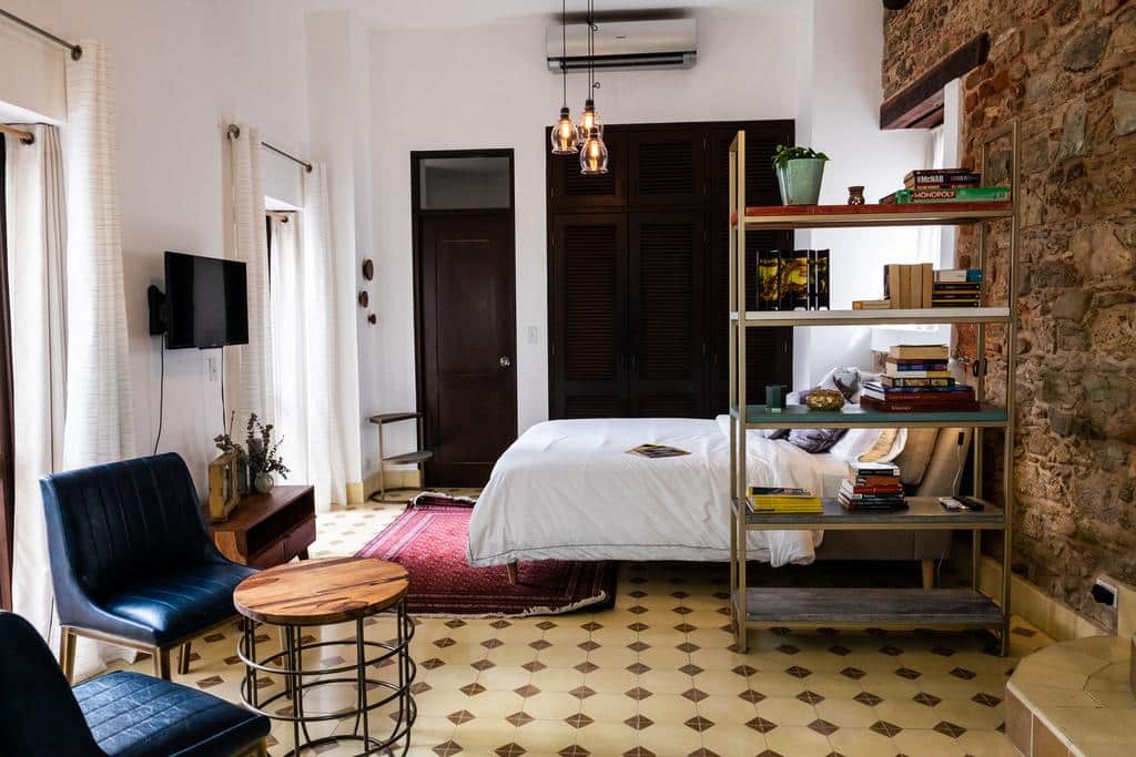 Stunning Small Loft at Casa Neuman bedroom area with chair and book shelve