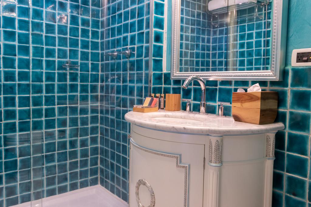 Some bathrooms have colorful mosaics in Villa Palma Boutique Hotel