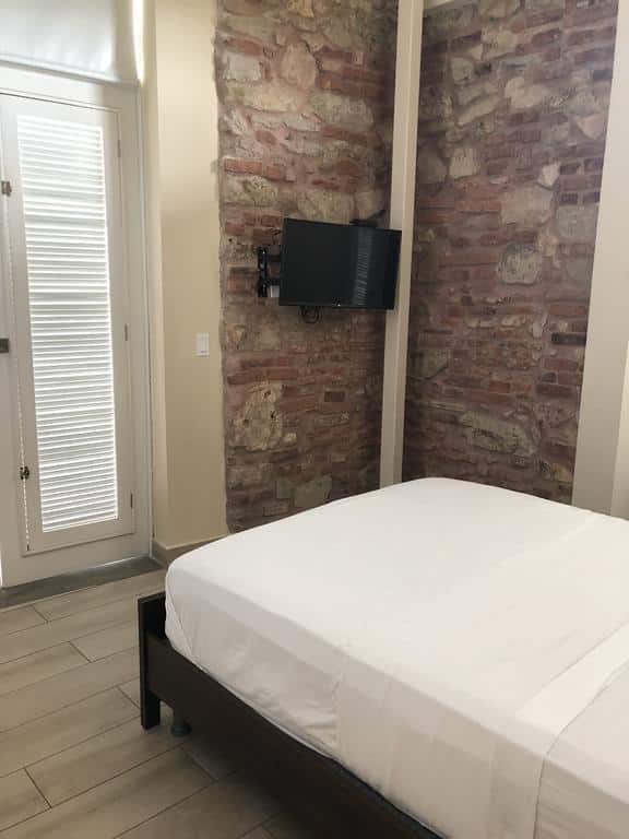 Rooms at Casa Franco are quite simple with a queen bed and television