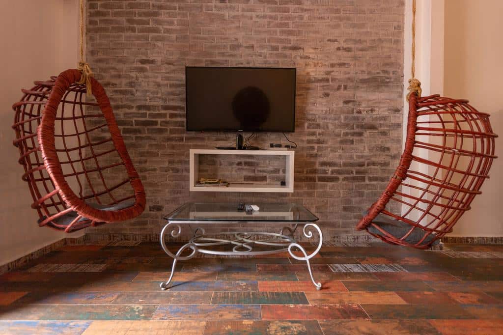 television with hanging chairs in Charming Apartment in Casco Viejo