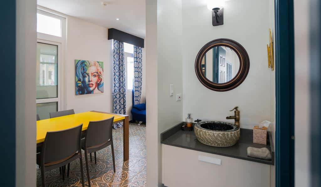Bathroom sink and living room of apartment 1A in Flor de Lirio  in Casco Viejo 