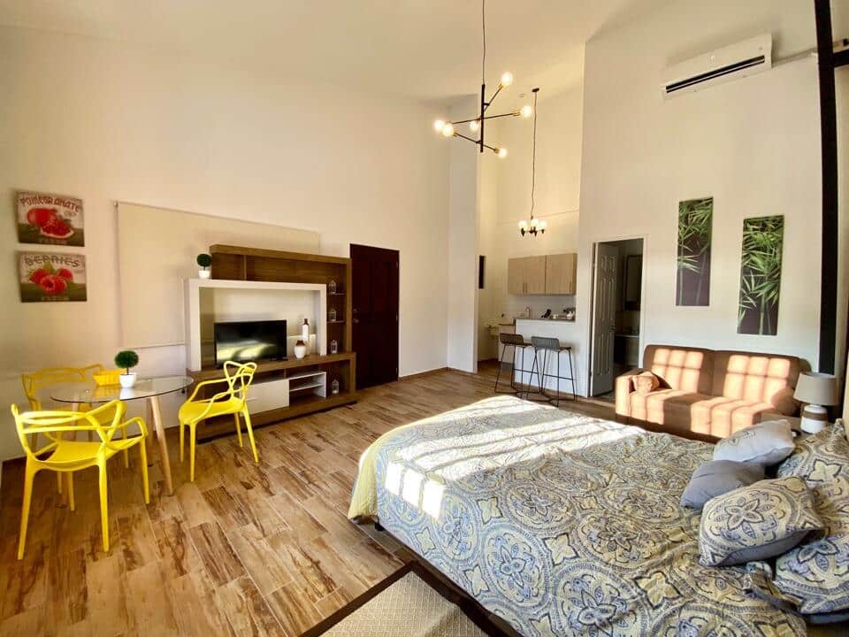 Suite of Vive Casco Antiguo in Casa Santana with dining table, sofa, bed, and kitchen